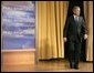 President George W. Bush walks onto the stage during his introduction before delivering remarks on the War on Terror in front of members of the World Affairs Council of Philadelphia, Monday, Dec. 12, 2005. White House photo by Eric Draper