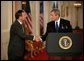 President George W. Bush shakes hands with his Supreme Court Justice Nominee John Roberts after his remarks on the State Floor of the White House, Tuesday evening, July 19, 2005. White House photo by Eric Draper