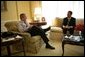 President George W. Bush and Judge John G. Roberts enjoy an early morning coffee at the residence Wednesday, July 20, 2005, in the White House. The President named Judge Roberts as his nominee to the U.S. Supreme Court Tuesday night. White House photo by Eric Draper