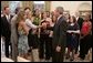 President George W. Bush welcomes Baylor University women's basketball coach Kim Mulkey-Robertson, her team and family members to the Oval Office, Wednesday, July 20, 2005, in honor of the Baylor University team winning the 2005 NCAA Women's Basketball championship. White House photo by Paul Morse