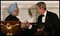 President George W. Bush and India's Prime Minister Dr. Manmohan Singh toast the evening in honor of Singh's visit, at the official dinner in the State Dining Room, Monday evening, July 18, 2005, at the White House. White House photo by Carolyn Drake