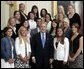 George W. Bush stands with members of the UCLA Women's Water Polo team Tuesday, July 12, 2005, during Championship Day at the White House. White House photo by David Bohrer