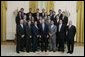 President George W. Bush stands with members of the UCLA Men's Water Polo Team Tuesday, July 12, 2005, during Championship Day at the White House. White House photo by David Bohrer