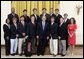 President George W. Bush stands with members of the University of Georgia Men's Golf Team during Championship Day Tuesday, July 12, 2005, at the White House. White House photo by David Bohrer