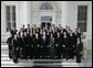 President George W. Bush stands with members of the Auburn University Men's Swimming and Diving team during Championship Day at the White House Tuesday, July 12, 2005. White House photo by Eric Draper