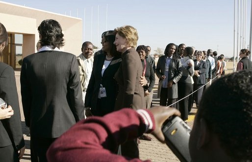 First Lady Laura Bush poses for pictures upon her departure Monday, July 11, 2005 at Gaborone International Airport in Gaborone, Botswana. White House photo by Krisanne Johnson