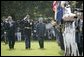 President George W. Bush reviews an honor guard with India's Prime Minister Dr. Manmohan Singh , Monday, July 18, 2005, on the South Lawn of the White House, during Singh's official arrival ceremony. White House photo by Eric Draper