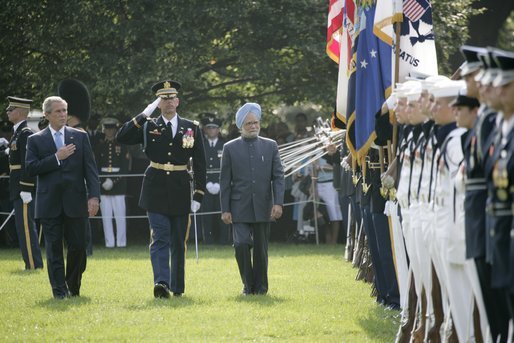 President George W. Bush reviews an honor guard with India's Prime Minister Dr. Manmohan Singh , Monday, July 18, 2005, on the South Lawn of the White House, during Singh's official arrival ceremony. White House photo by Eric Draper