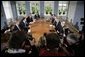 President George W. Bush meets with Danish Prime Minister Anders Fogh Rasmussen, center, left, at his summer residence in Marienborg in Kongens Lyngby, Denmark, Wednesday, July 6, 2005. White House photo by Eric Draper