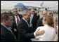 Employees and their children from the American Embassy in Denmark gather to bid farewell to President George W. Bush at Copenhagen's International Airport Wednesday, July 6, 2005. White House photo by Paul Morse