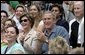 President George W. Bush and Mrs. Laura Bush cheers on players during a Tee Ball game on the South Lawn of the White House between the District 12 Little League Challengers from Williamsport, PA and the West University Little League Challengers from Houston, Texas on Sunday July 24, 2005. White House photo by Paul Morse