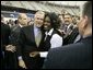 President George W. Bush greets the audience following remarks at the Indiana Black Expo Corporate Luncheon in Indianapolis, Indiana, Thursday, July 14, 2005. White House photo by Eric Draper