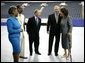 President George W. Bush is joined backstage by event participants before delivering remarks at the Indiana Black Expo Corporate Luncheon in Indianapolis, Ind., Thursday, July 14, 2005. Pictured with the President, from left are: Indiana Black Expo President Joyce Rogers, Chairman Arvis Dawson, Indiana Governor Mitch Daniels, and Congresswoman Julia Carson. White House photo by Eric Draper