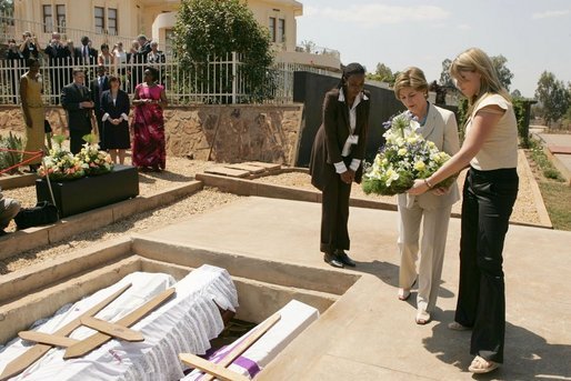 Laura Bush and daughter Jenna lay a wreath Thursday, July 14, 2005 at the Kigali Memorial Center-Gisozi Genocide Memorial in Kigali, Rwanda. White House photo by Krisanne Johnson