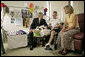 President George W. Bush talks with U.S. Army Specialist Nicholas Beintema and his mother Stacy Beintema of Woodbridge, Calif., while visiting wounded troops at Walter Reed Army Medical Hospital Friday, July 1, 2005. Spc. Beintema was wounded while serving in Operation Iraqi Freedom. White House photo by Eric Draper