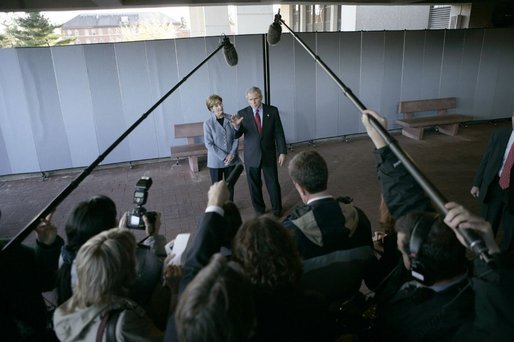 President George W. Bush and Laura Bush meet with the press after visiting with wounded soldiers and their families at Walter Reed Army Medical Center in Washington, D.C., Tuesday, Nov. 9, 2004. White House photo by Eric Draper.