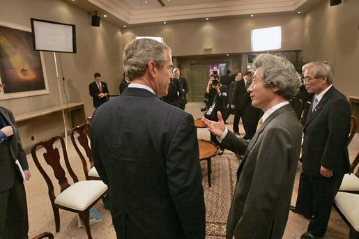 President George W. Bush participates in a morning meeting with Japanese Prime Minister Junichiro Koizumi while attending an APEC summit in Santiago, Chile, Nov. 20, 2004. White House photo by Eric Draper