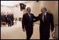 President George W. Bush and Canadian Prime Minister Paul Martin share a light moment after a bilateral meeting in Santiago, Chile, Nov. 20, 2004. President Bush and Prime Minister Martin are joined in Chile by the leaders of 19 other countries attending this year's APEC summit. White House photo by Eric Draper