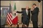 President George W. Bush talks with Mexican President Vicente Fox at the 2004 APEC summit in Santiago, Chile, Nov. 21, 2004. White House photo by Eric Draper