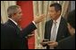 President George W. Bush meets with Prime Minister Lee Hsien Loong of Singapore during the APEC Summit at La Moneda Presidential Palace in Santiago, Chile, Sunday, Nov. 21, 2004. White House photo by Paul Morse