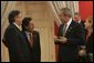 President George W. Bush meets with President Alejandro Toledo of Peru, Manuel Rodriguez Cuadros, Foreign Minister of Peru, far left, and President Toledo's wife, Ms. Elaine Karp, during the APEC Summit at La Moneda Presidential Palace in Santiago, Chile, Sunday, Nov. 21, 2004. White House photo by Eric Draper