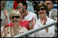 Mrs. Laura Bush and Lynne Pace, wife of General Peter Pace, front-left, applaud the Little League players taking the field at the opening Tee Ball game of the 2006 season on the South Lawn of the White House, Friday, June 23, 2006. General Pace was the Tee Ball Commissioner for the game. White House photo by Shealah Craighead