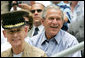 President George W. Bush is joined by General Peter Pace, chairman of the Joint Chiefs of Staff and Tee Ball Commissioner for the opening Tee Ball game of the 2006 season on the South Lawn of the White House, Friday, June 23, 2006, between the McGuire AFB Little League Yankees and the Dolcom Little League Indians of the Naval Submarine Base from Groton, Ct. White House photo by Shealah Craighead