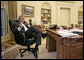 President George W. Bush talks with Prime Minister Nouri al-Maliki of Iraq regarding the death of terrorist al Zarqawi from the Oval Office Thursday morning, June 8, 2006. White House photo by Eric Draper