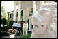 President George W. Bush, Laura Bush and Japanese Prime Minister Junichiro Koizumi are welcomed to Graceland, the home of Elvis Presley, by his former wife Priscilla Presley and their daughter Lisa-Marie Presley, Friday, June 30, 2006 in Memphis. White House photo by Eric Draper