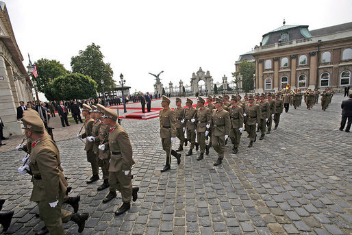 Hungarian troops march in front of Sandor Palace during an arrival ceremony for President George W. Bush in Budapest, Hungary, Thursday, June 22, 2006. White House photo by Eric Draper