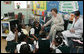 Mrs. Laura Bush talks with students during her visit to Our Lady of Perpetual Help School in Washington, Monday, June 5, 2006, where she announced a Laura Bush Foundation for America’s Libraries grant to the school. Mrs. Bush is joined by Our Lady of Perpetual Help fifth grade teacher Julie Sweetland, right. White House photo by Shealah Craighead