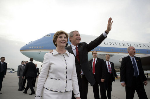 President George W. Bush waves as he and Laura Bush arrive at Budapest-Ferihegy Airport in Budapest Wednesday night, June 21, 2006, on the last leg of their journey to Europe. White House photo by Eric Draper