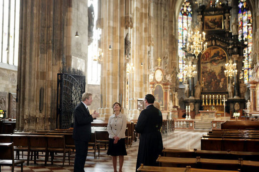 Mrs. Laura Bush admires the architecture of St. Stephen's Cathedral in Vienna, Austria, Wednesday, June 21, 2006, during a tour guided by Bernd Kolodziejczak, left, and Father Timothy McDonnell, right. The cathedral is of one of Vienna's most famous sights built in 1147 AD. White House photo by Shealah Craighead