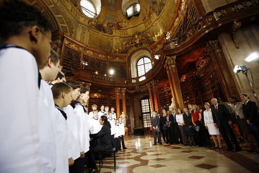 President George W. Bush and Mrs. Laura Bush listen to the Vienna Boys Choir at the National Library at Hofburg Palace in Vienna, June 21, 2006. White House photo by Eric Draper