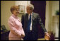 President George W. Bush talks with President Vaira Vike-Freiberga of Latvia in the Roosevelt Room Thursday, June 8, 2006. White House photo by Kimberlee Hewitt