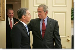 President George W. Bush welcomes Colombian President Alvaro Uribe to the Oval Office Wednesday, June 14, 2006. White House photo by Paul Morse