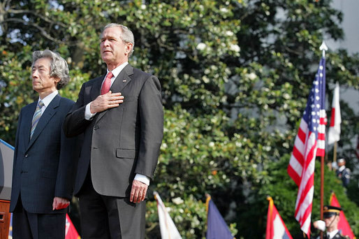 President George W. Bush and Prime Minister Junichiro Koizumi of Japan stand for the playing of the two countries' national anthems during the arrival ceremony on the South Lawn Thursday, June 29, 2006. White House photo by Shealah Craighead