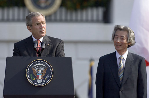 President George W. Bush delivers an address during an arrival ceremony for Prime Minister Junichiro Koizumi of Japan on the South Lawn Thursday, June 29, 2006. "Decades ago, our two fathers looked across the Pacific and saw adversaries, uncertainty and war," said President Bush. "Today their sons look across that same ocean and see friends and opportunity and peace." White House photo by Paul Morse