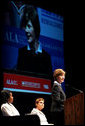 Mrs. Laura Bush flanked by Caitlyn Clarke, left, and Leslie Berger, ALA president-elect, Monday, June 26, 2006, announced that the Institute of Museum and Library Services’ Librarians for the 21st Century Program is awarding more than $20 million to support almost 3,900 library-science students at 35 universities, during the 2006 American Library Association Conference in New Orleans, Louisiana. White House photo by Shealah Craighead