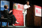 Mrs. Laura Bush applauds Caitlyn Clarke, high school Student of the Year for Jefferson Parish Public School System, Monday, June 26, 2006, as Miss Clarke speaks of her passion for reading before introducing Mrs. Bush during the 2006 American Library Association Conference in New Orleans, Louisiana. White House photo by Shealah Craighead