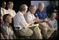 President George W. Bush speaks during a meeting with local officials and business leaders, including Mississippi Governor Haley Barbour, right, in Gulfport, Miss., Tuesday, Sept. 20, 2005. White House photo by Eric Draper