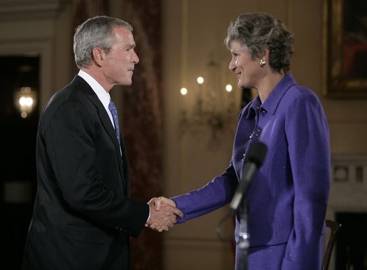 President George W. Bush congratulates Karen Hughes after her swearing-in by U.S. Secretary of State Condoleezza Rice, Friday, Sept. 9, 2005 at the State Department in Washington, to be the Under Secretary of State for Public Diplomacy. White House photo by Eric Draper