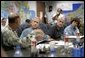 President George W. Bush receives a briefing from U.S. Army Lt. General Russel Honore, left, inside the Emergency Operations Center in Baton Rouge, La., Monday Sept. 5, 2005, as Homeland Security Secretary Michael Chertoff, second from right, and Louisiana Governor Kathleen Blanco, right, join the meeting. White House photo by Eric Draper