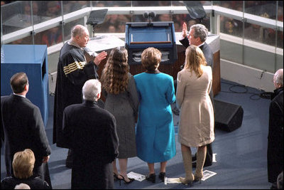 Supreme Court Chief Justice William Rehnquist swears in President George W. Bush to his first term of office Jan. 20, 2001. White House photo by Eric Draper