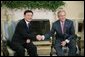 President George W. Bush shakes hands with Thailand's Prime Minister Thaksin Shinawatra, during a visit to the Oval Office at the White House, Monday, Sept. 19, 2005 in Washington. White House photo by Eric Draper