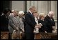 President George W. Bush bows his head in prayer during the National Day of Prayer and Remembrance Service at the Washington National Cathedral in Washington, D.C., Friday, Sept. 16, 2005. Also pictured are Laura Bush, Lynne Cheney Vice President Cheney, Secretary Rice and Secretary Rumsfeld. White House photo by Eric Draper