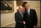 President George W. Bush welcomes Russian President Vladimir Putin into the Oval Office at the White House, Friday, Sept. 16, 2005 in Washington. White House photo by Eric Draper