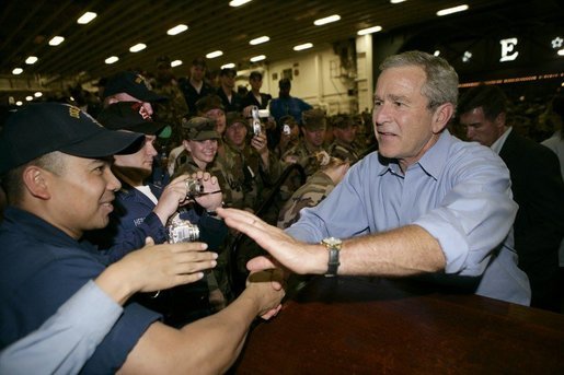 President George W. Bush greets sailors aboard the USS Iwo Jima after delivering remarks on hurricane recovery efforts during an Address to the Nation in New Orleans, La., Thursday, Sept. 15, 2005. White House photo by Eric Draper