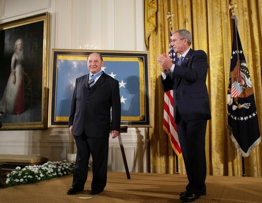 President George W. Bush applauds Korean War era veteran Corporal Tibor "Ted" Rubin, after awarding Rubin the Medal of Honor, Friday, Sept. 23, 2005 at cermonies at the White House in Washington. Rubin was honored for his actions under fire, and his bravery while in captivity at a Chinese POW camp. White House photo by Paul Morse