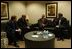 President George W. Bush meets with, from left, William Clay Ford Jr., Chairman & CEO of Ford Motor Company; Dieter Zetsche, President & CEO of Chrysler Group; and Richard Wagoner, President & CEO of General Motors Corp., at the Ford Community and Performing Arts Center in Dearborn, Mich., Monday, April 28, 2003.